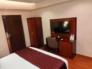 Postel nebo postele na pokoji v ubytování Park Avenue Hotel & Apartments Trichy