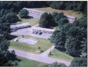 an aerial view of a building with trees and a street at Four Seasons Motel in Catskill