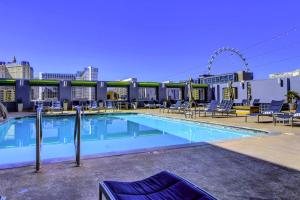 a large swimming pool on top of a building at Idyllic Suite - Las Vegas in Las Vegas