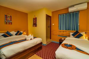Voodi või voodid majutusasutuse Kwabahal Garden Hostel toas