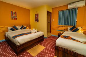 Voodi või voodid majutusasutuse Kwabahal Garden Hostel toas