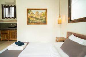 Postel nebo postele na pokoji v ubytování Nomada Villas