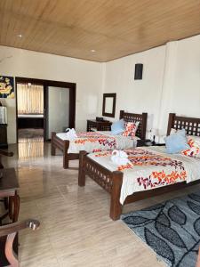 Postel nebo postele na pokoji v ubytování Kookie Place Homestay