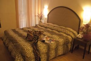 Postel nebo postele na pokoji v ubytování Hotel Novecento