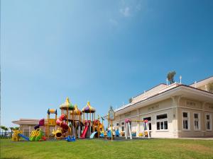 a playground in a park in front of a building at Gural Premier Belek in Belek