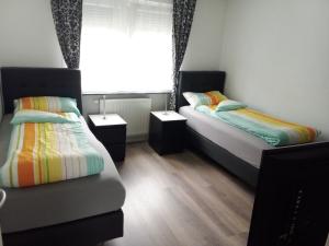 Postel nebo postele na pokoji v ubytování Apartments Metzingen Panoramablick