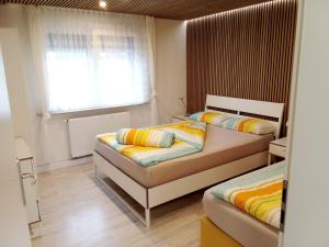 Postel nebo postele na pokoji v ubytování Apartments Metzingen Panoramablick