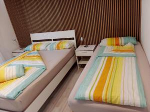 Postel nebo postele na pokoji v ubytování Apartments Metzingen Panoramablick