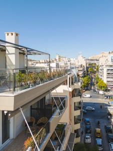 a balcony of a building with plants on it at Tyto Alba Habitat in Athens