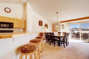 a kitchen and dining room with a table and chairs at 172 Sauterne Sanctuary Townhouse in Silverthorne