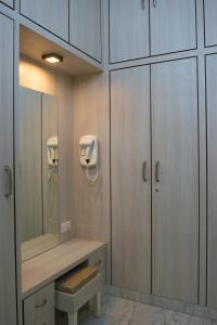 a bathroom with a sink and a large mirror at Casa Romana- Indulgent Comfort in Lake and Hill View Rooms in Udaipur +44 photos
