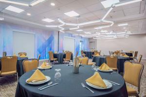 a conference room with a table and chairs at Hilton Garden Inn Danbury in Danbury
