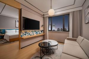 Télévision ou salle de divertissement dans l'établissement Hilton Garden Inn Shanghai Caoyang