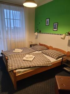 Postel nebo postele na pokoji v ubytování Pension Pastis