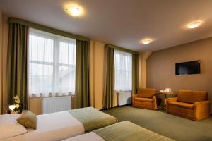 Postel nebo postele na pokoji v ubytování Hotel Galicya