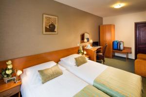 Postel nebo postele na pokoji v ubytování Hotel Galicya