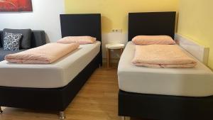 Postel nebo postele na pokoji v ubytování Apartment Metzingen City
