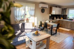 a living room with a couch and a table at Domek u Basi in Czorsztyn