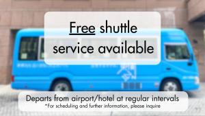 a blue van with the words free shuttle service available at Toyoko Inn Chubu International Airport No1 in Tokoname