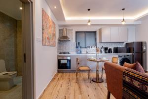 Kuchyň nebo kuchyňský kout v ubytování Elite One Bedroom Apartment,Swimming pool, gym, workspace ,Wonderiss Homes close proximity to GTC, JW Mariott and Kempinski