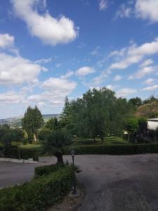 a parking lot with trees and a parking meter at Agriturismo Casamia in Paglieta