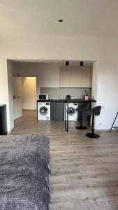 a room with a kitchen with a table and appliances at Apartment VIP Virmenska Street in Lviv