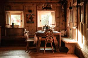 a dining room with a table and two chairs at Hunters Lodge Chalet Superior in Alpbach +44 photos