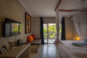 Postel nebo postele na pokoji v ubytování Visiwa Beach Resort + 37 fotografií