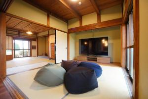 a room with two bean bags on the floor at Sauna Private Villa AO in Takashima