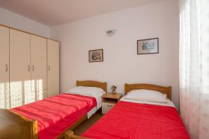 Postel nebo postele na pokoji v ubytování Apartments Marina