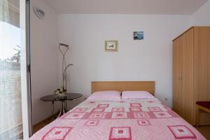 Postel nebo postele na pokoji v ubytování Apartments Marina