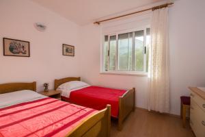 Postel nebo postele na pokoji v ubytování Apartments Marina