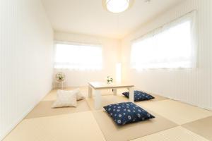 Postel nebo postele na pokoji v ubytování Miraie Awaji Kuruma95 + 24 fotografií