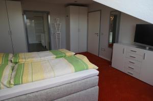 Letto o letti in una camera di Haus Delphin