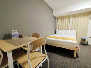 Postel nebo postele na pokoji v ubytování incense上野根岸201