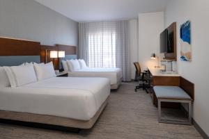 Ένα ή περισσότερα κρεβάτια σε δωμάτιο στο EVEN Hotel Bozeman Yellowstone Intl Arpt by IHG