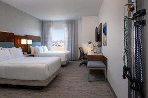 Ένα ή περισσότερα κρεβάτια σε δωμάτιο στο EVEN Hotel Bozeman Yellowstone Intl Arpt by IHG