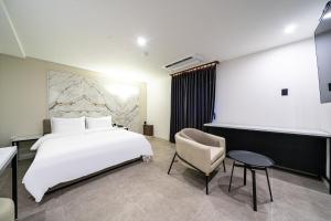 Seosan Hotel Posto客房内的一张或多张床位