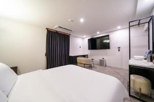 Seosan Hotel Posto客房内的一张或多张床位