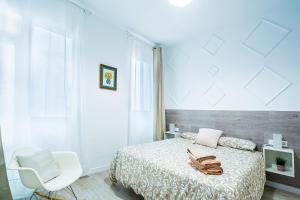 A bed or beds in a room at CARTAGENAFLATS, Apartamentos San Francisco