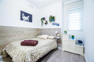 A bed or beds in a room at CARTAGENAFLATS, Apartamentos San Francisco