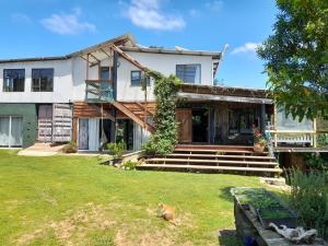an exterior view of a house with a yard at Butterfly House in The Crags