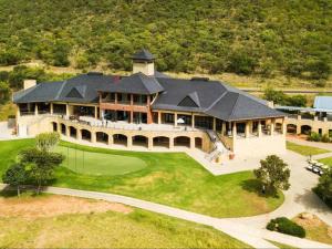 an aerial view of a large house with a golf green at Euphoria Golf Estate House 196 Rooibok in Naboomspruit