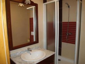 a bathroom with a sink and a shower at Villa Luef in Mönichkirchen +52 photos