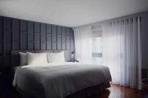 Letto o letti in una camera di Reddot Hotel