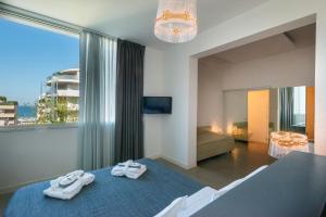 Posteľ alebo postele v izbe v ubytovaní Perla Verde Hotel