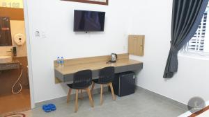 TV a/nebo společenská místnost v ubytování Vy An Hotel
