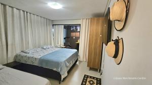 En eller flere senge i et værelse på FLAT PÉ NA AREIA Carneiros Tamandaré