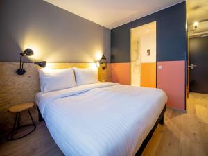 Rúm í herbergi á ibis Styles Wien Messe Prater