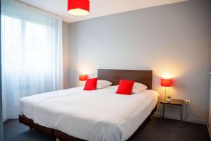 Postel nebo postele na pokoji v ubytování Comfort Aparthotel Besancon La City